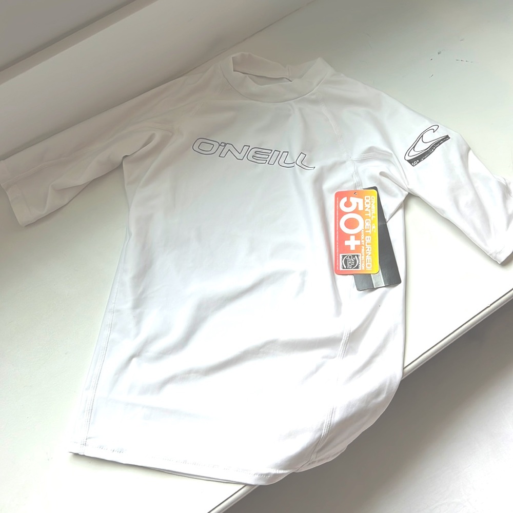 BRAND NEW boys white rash guard size 16 runs a little small.